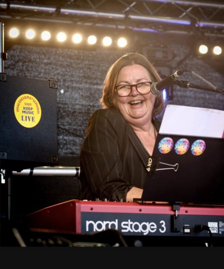 Vanessa onstage playing her Nord stage 3 keyboard. Keep music live. Thame music in the park